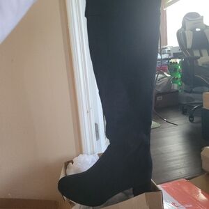 Black over the knee boot.